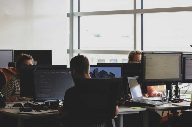 Linkage Design Training center - several desktop displays with a few people working at them