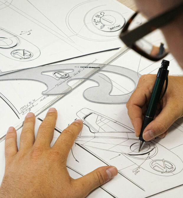 Over the shoulder view of man sketching for industrial design